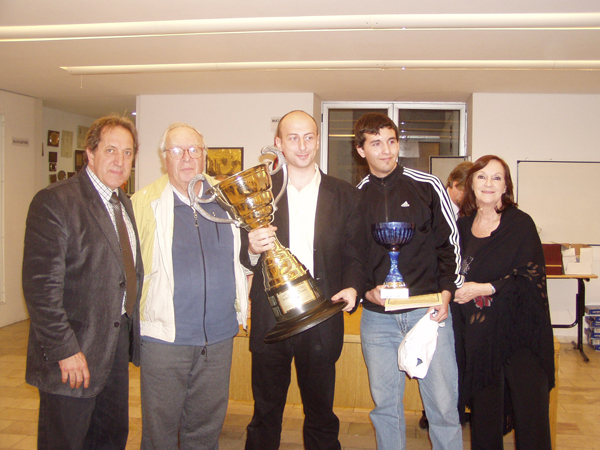 Picture of the winning trophy being held by Stanislav Tsukrov operator and author of the Pocket Fritz GUI in which HIARCS ran